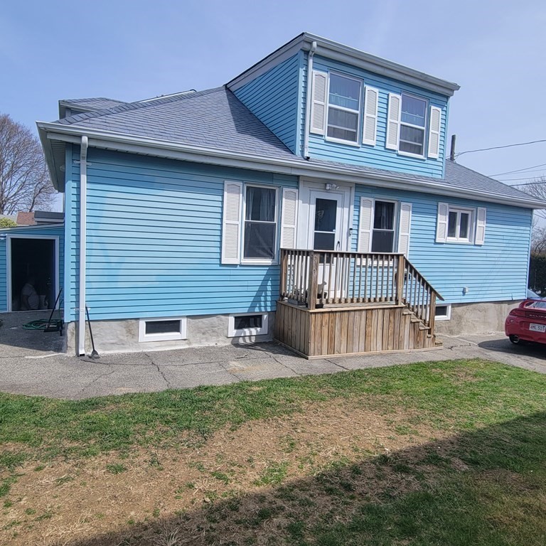 77 Carter Street Fall River, MA 02721 - Photo 2 of 25 a front view of a house with garden