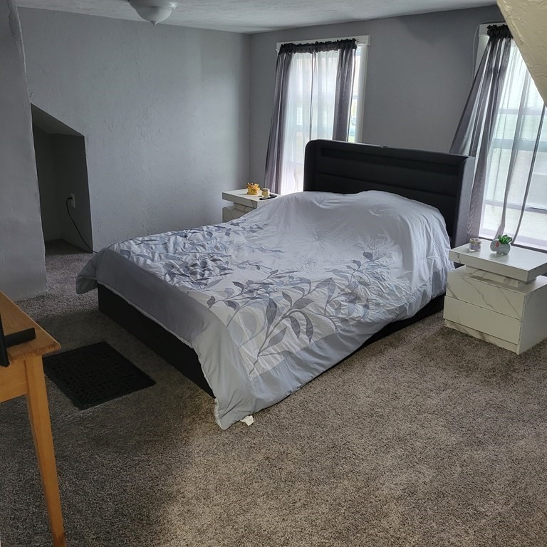 77 Carter Street Fall River, MA 02721 - Photo 23 of 25 a bedroom with a bed and window