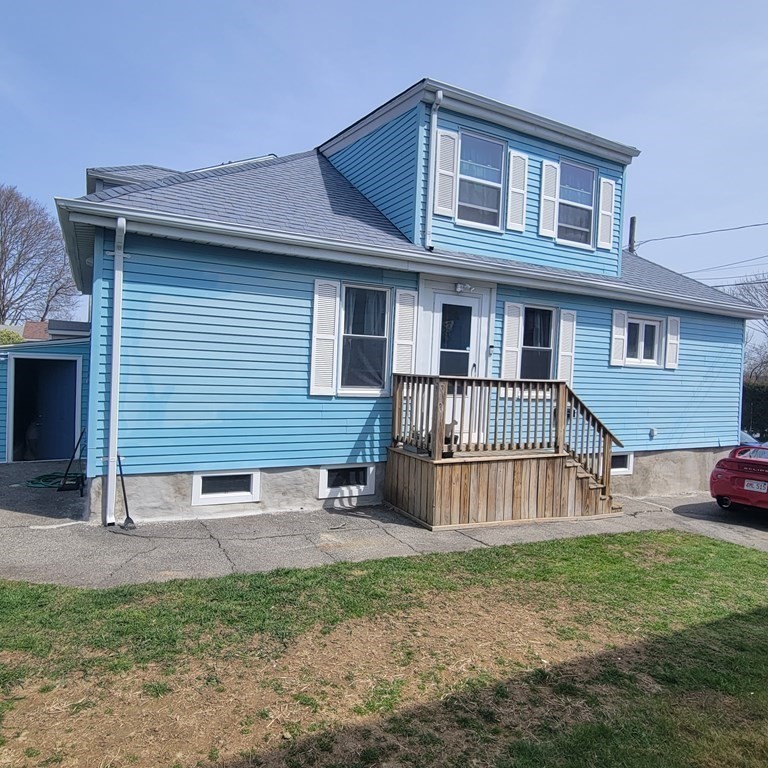 77 Carter Street Fall River, MA 02721 - Photo 24 of 25 a front view of a house with a yard