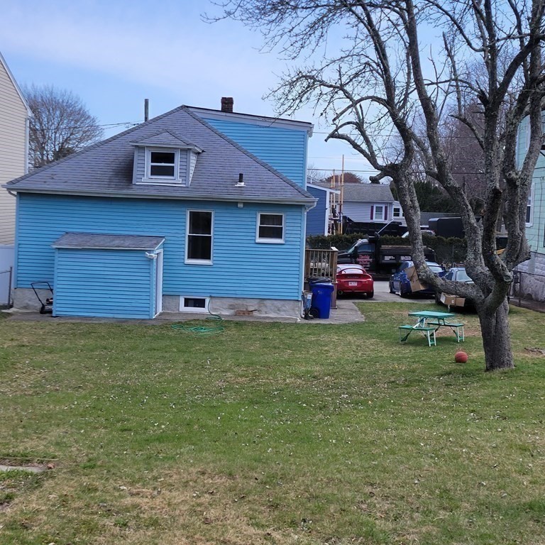77 Carter Street Fall River, MA 02721 - Photo 5 of 25 a front view of a house with a garden
