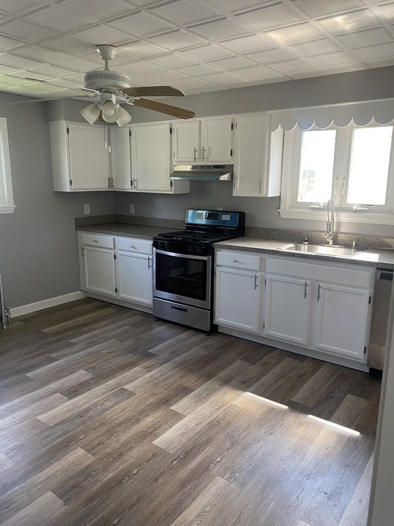 77 Carter Street Fall River, MA 02721 - Photo 7 of 25 a large kitchen with granite countertop a stove and a sink