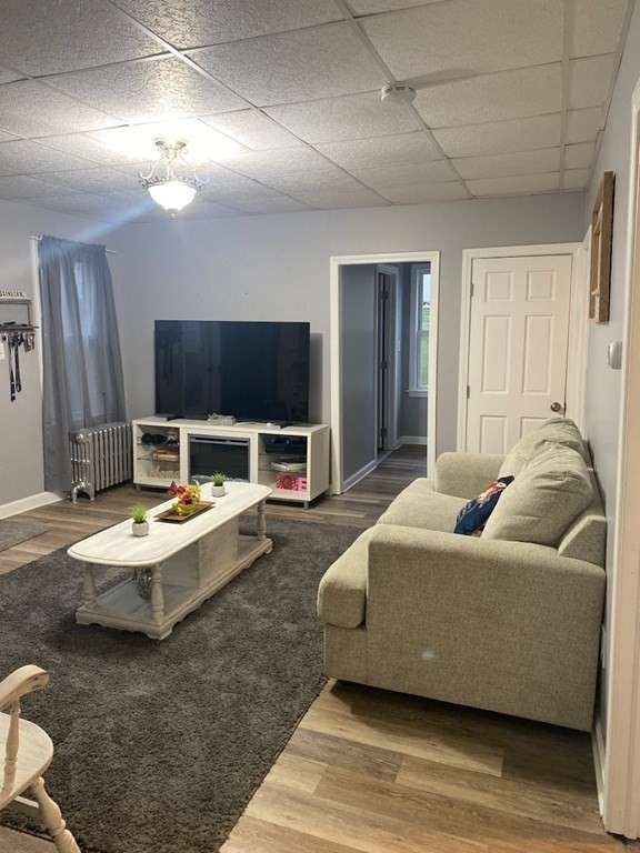 77 Carter Street Fall River, MA 02721 - Photo 10 of 25 a living room with furniture and a flat screen tv