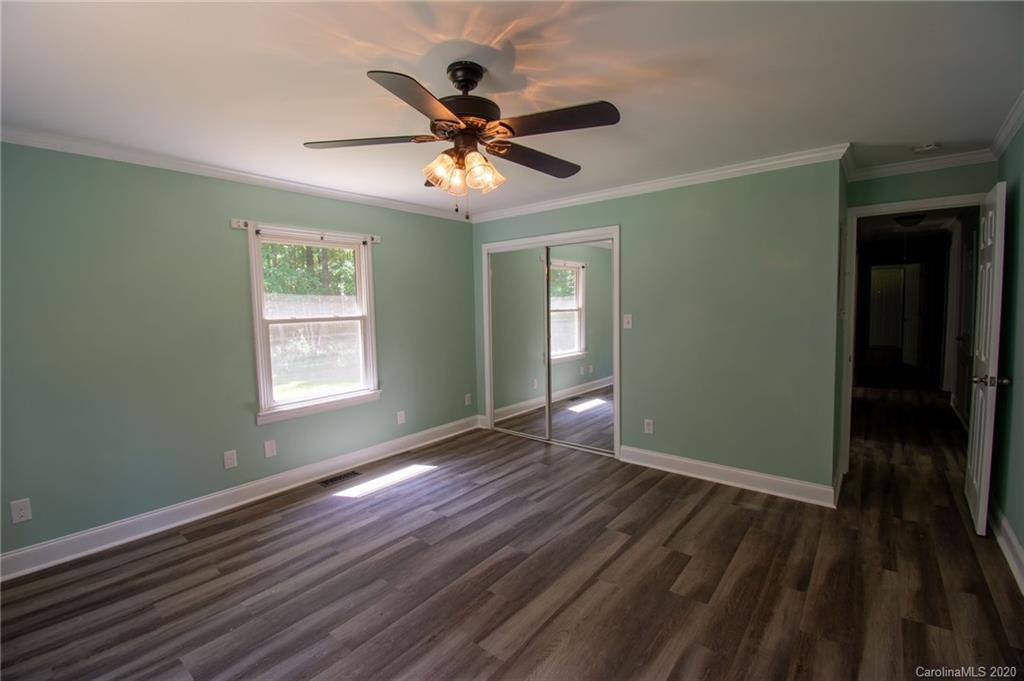 6522 Austin Road Monroe, NC 28112 - Photo 8 of 19 wooden floor in an empty room with a window