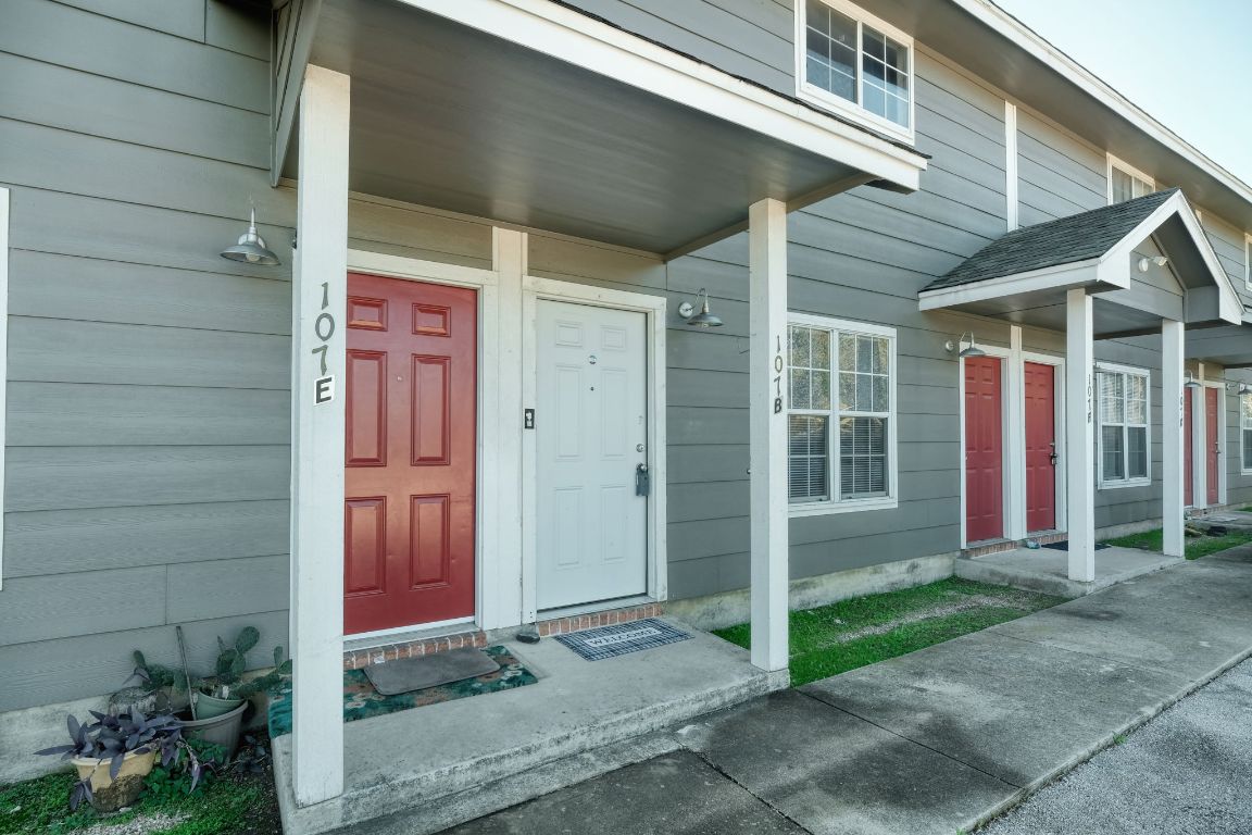 107 Castleberry Court, Unit B Bertram, TX 78605 - Photo 2 of 15 a view of small house with potted plants