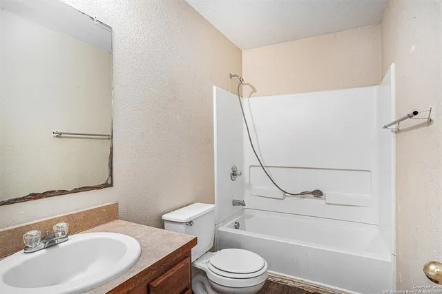 a bathroom with a sink toilet and a bathtub