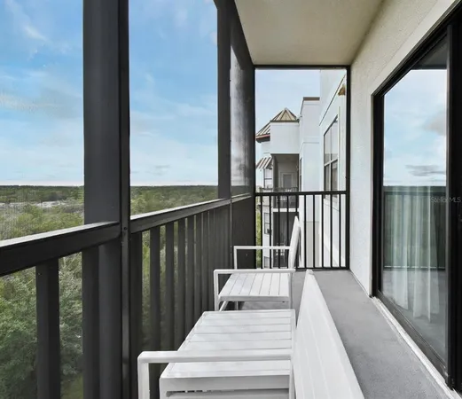 a view of balcony with furniture