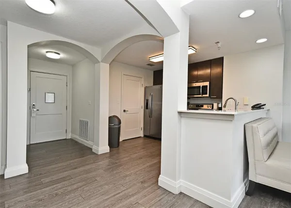 a view of kitchen with cabinets and wooden floor