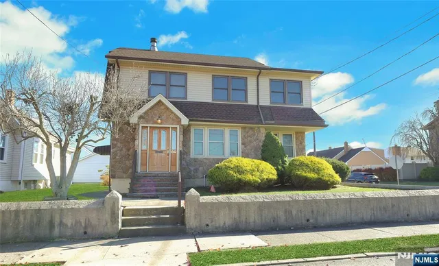 a front view of a house with garage