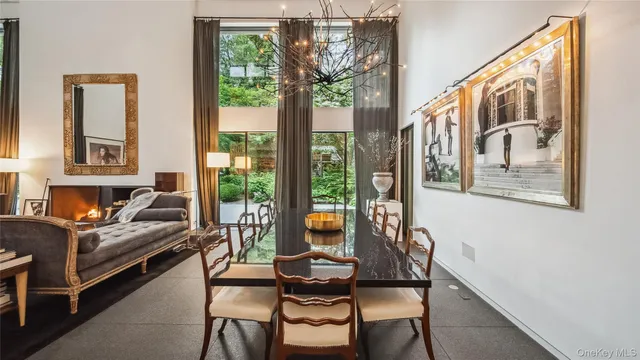 a large kitchen with stainless steel appliances and a view of living room