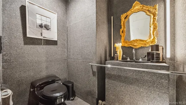 a living room with furniture and a painting