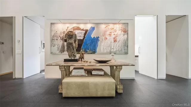 a view of an entryway with wooden floor