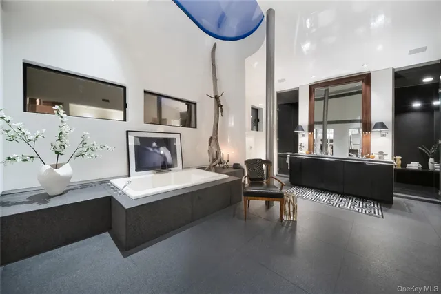 a white cabinet with glass top door