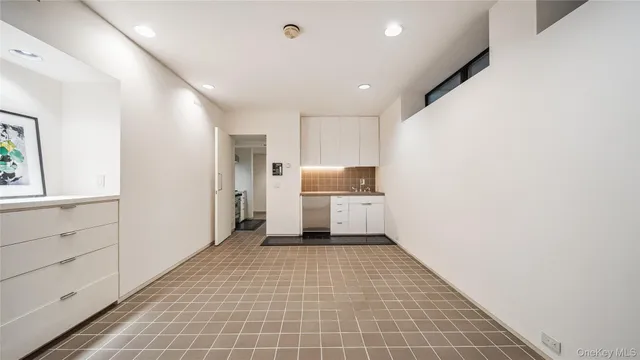 a view of a patio with table and chairs and potted plants