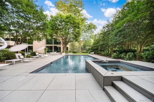 a view of a patio with table and chairs and potted plants