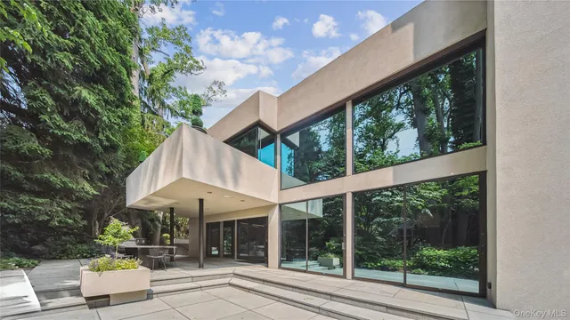 a view of a pathway with a house in the background