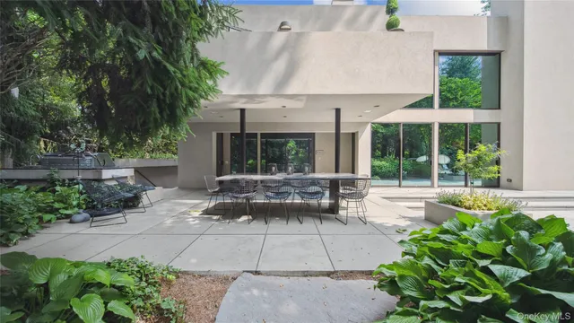 a view of a swimming pool with an outdoor space and seating area