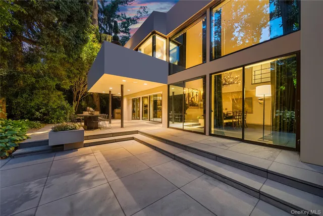 an aerial view of a house with a yard and garden
