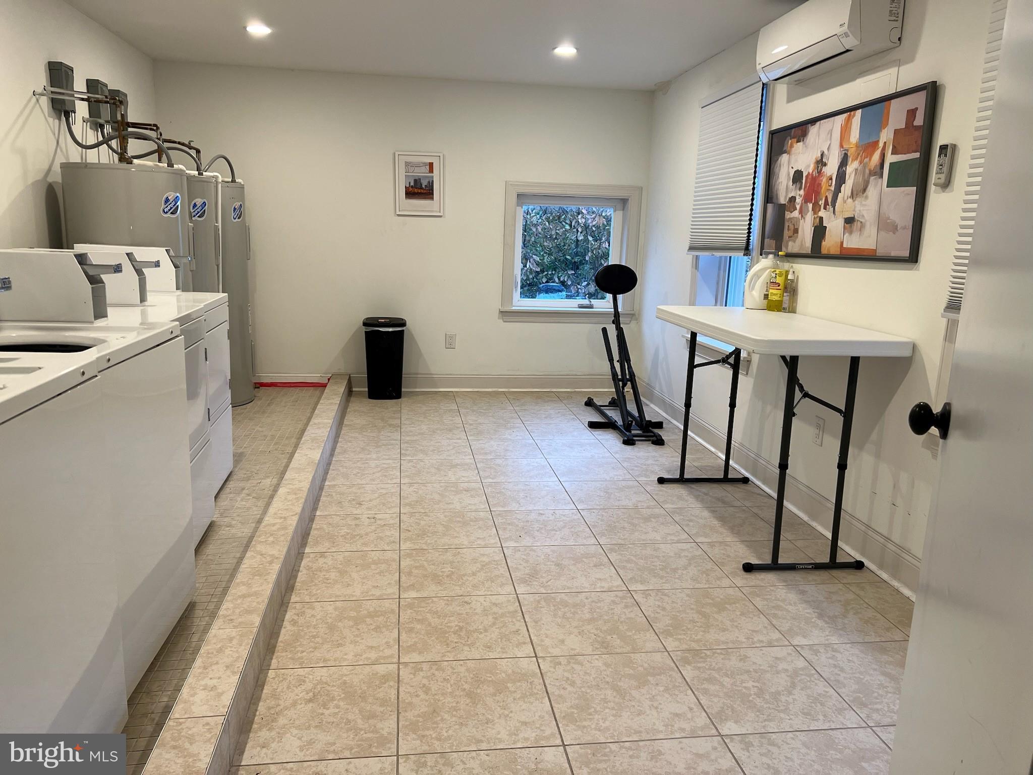 235 Pine Street Philadelphia, PA 19106 - Photo 16 of 18 a workspace with furniture and wall paintings