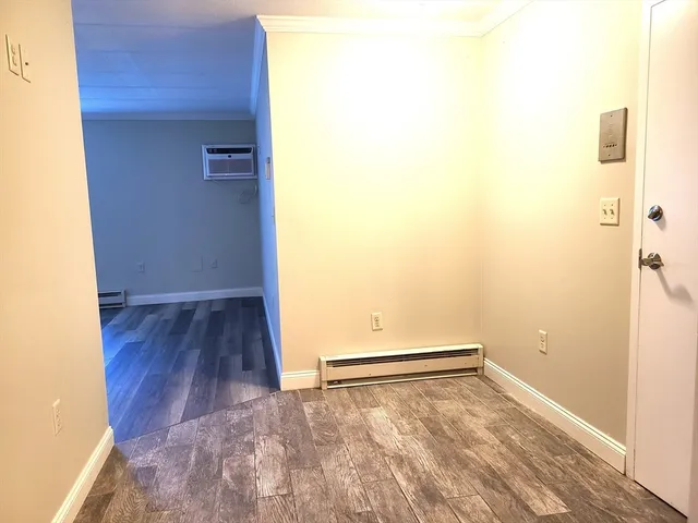 a view of a small space with wooden floor