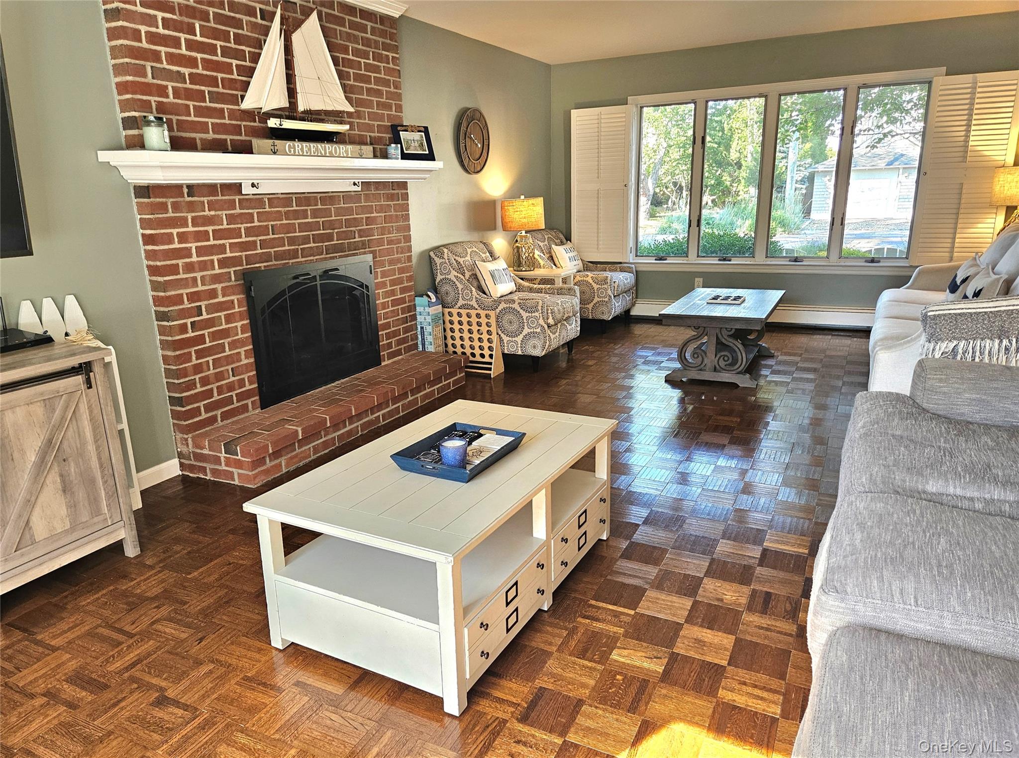 3650 Bay Shore Road Greenport, NY 11944 - Photo 18 of 30 a living room with furniture and a fireplace