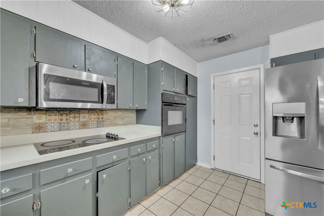 806 County Road 4756 Kempner, TX 76539 - Photo 13 of 33 a kitchen with a sink stainless steel appliances and cabinets