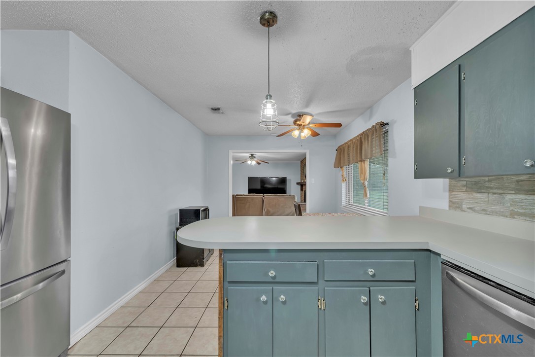 806 County Road 4756 Kempner, TX 76539 - Photo 14 of 33 a view of a kitchen with a sink and refrigerator