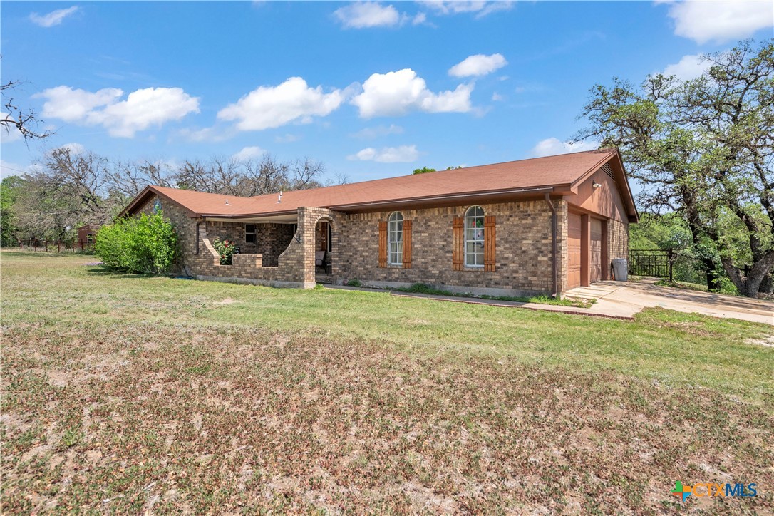 806 County Road 4756 Kempner, TX 76539 - Photo 2 of 33 a front view of a house with garden