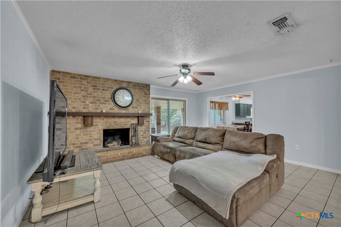 806 County Road 4756 Kempner, TX 76539 - Photo 6 of 33 a living room with furniture and a fireplace