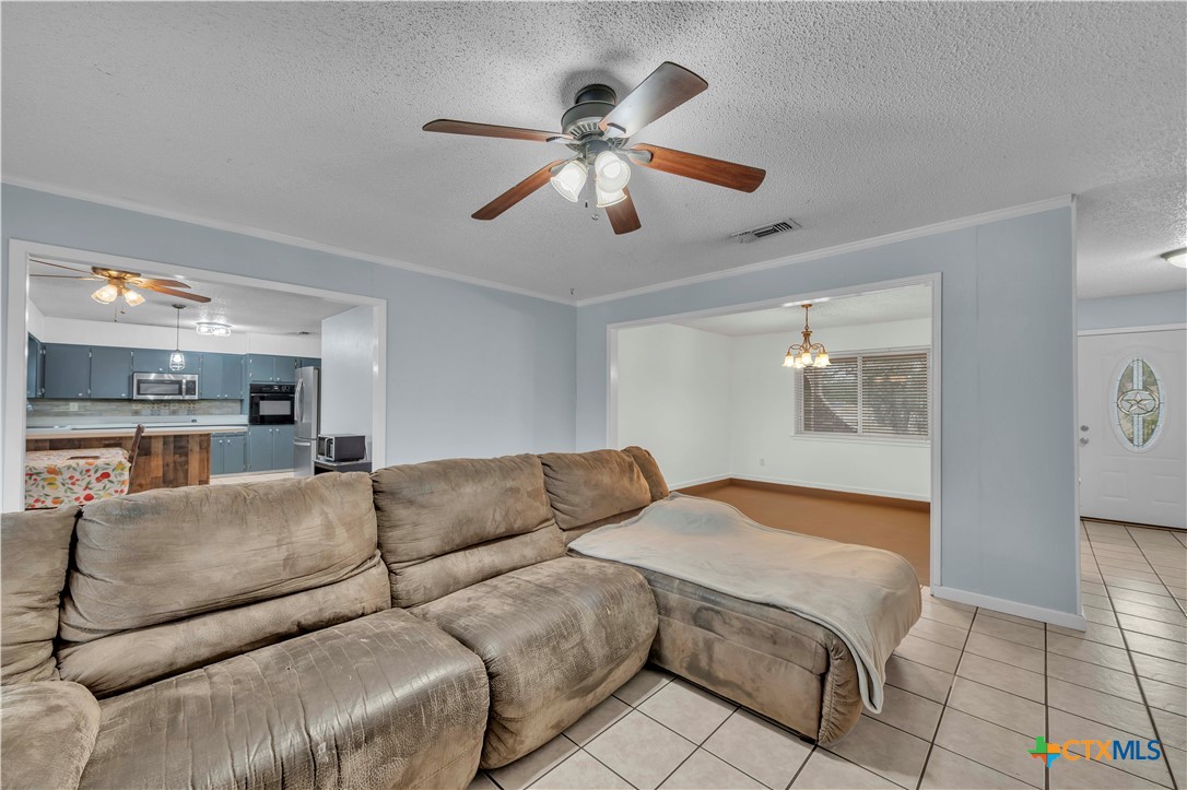 806 County Road 4756 Kempner, TX 76539 - Photo 8 of 33 a living room with furniture and a ceiling fan