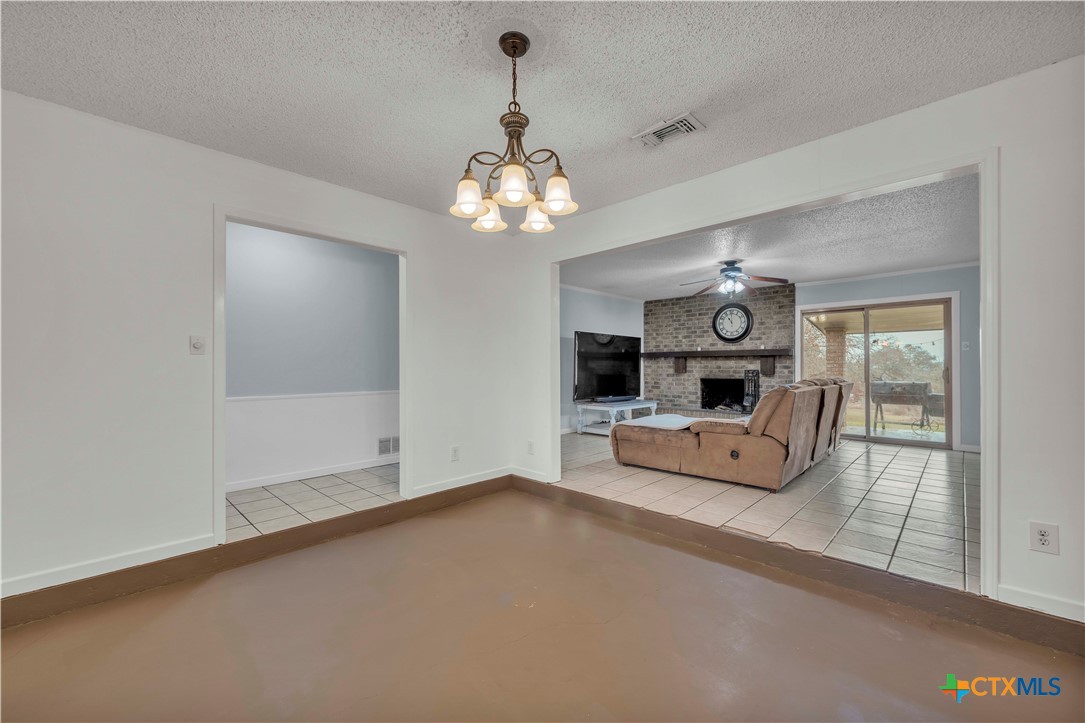 806 County Road 4756 Kempner, TX 76539 - Photo 10 of 33 a living room with furniture and a chandelier