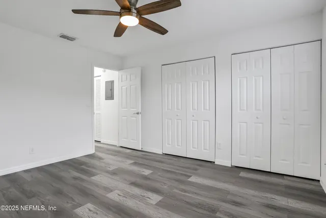 an aerial view of a house with a garden and swimming pool
