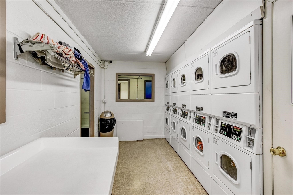 200 Swanton Street, Unit 630 Winchester, MA 01890 - Photo 8 of 26 a view of a livingroom with washer and dryer