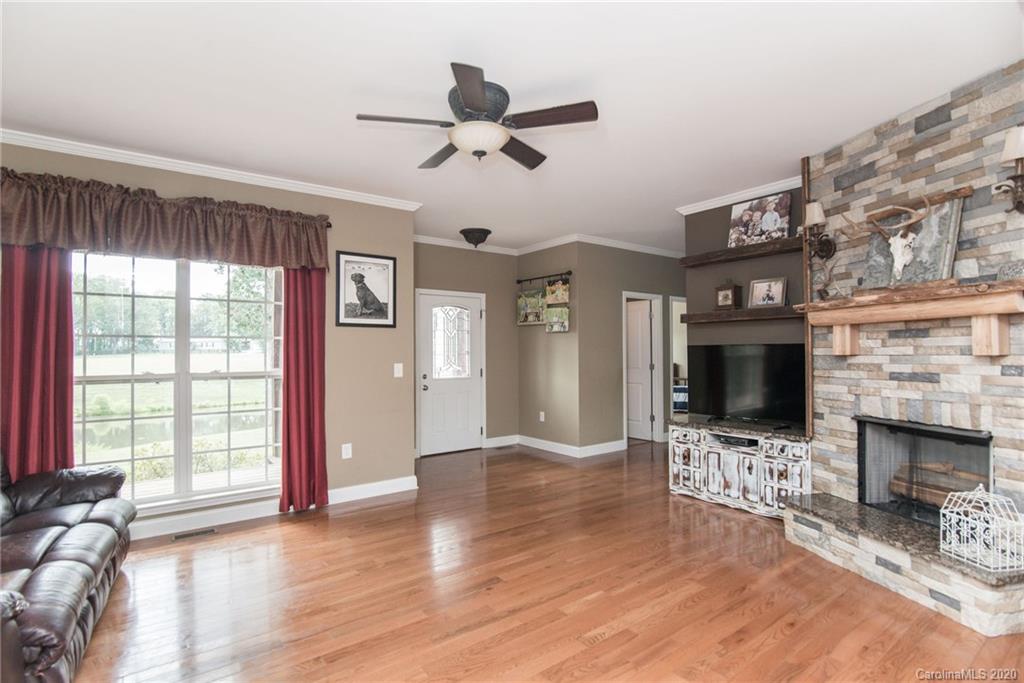 725 Hawley Road McConnells, SC 29726 - Photo 11 of 32 a view of livingroom with flat screen tv ceiling fan and window