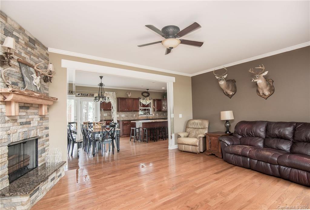 725 Hawley Road McConnells, SC 29726 - Photo 12 of 32 a living room with furniture wooden floor and a fireplace
