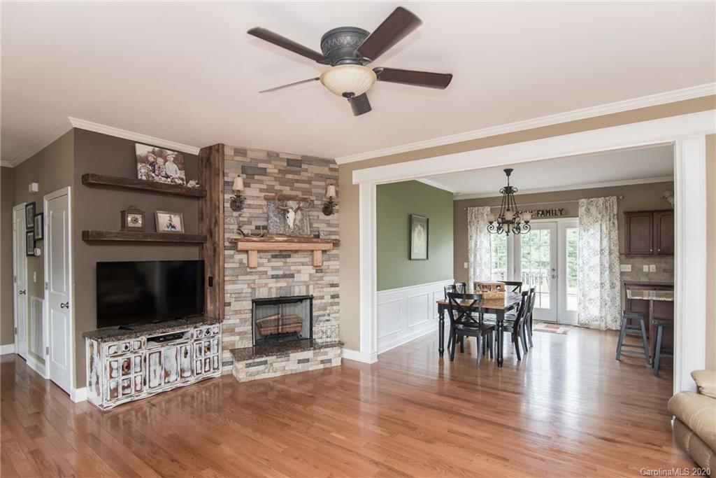 725 Hawley Road McConnells, SC 29726 - Photo 13 of 32 a living room with furniture a fireplace and a flat screen tv
