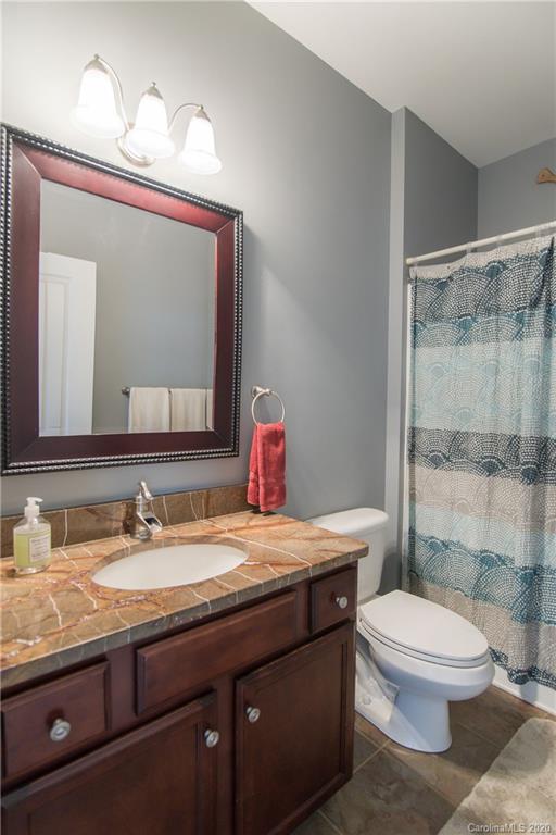 725 Hawley Road McConnells, SC 29726 - Photo 17 of 32 a bathroom with a granite countertop toilet sink and mirror