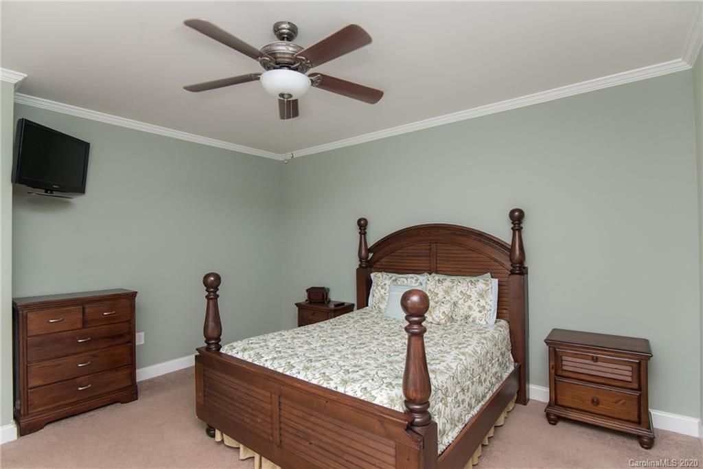 725 Hawley Road McConnells, SC 29726 - Photo 19 of 32 a bedroom with a bed and a ceiling fan