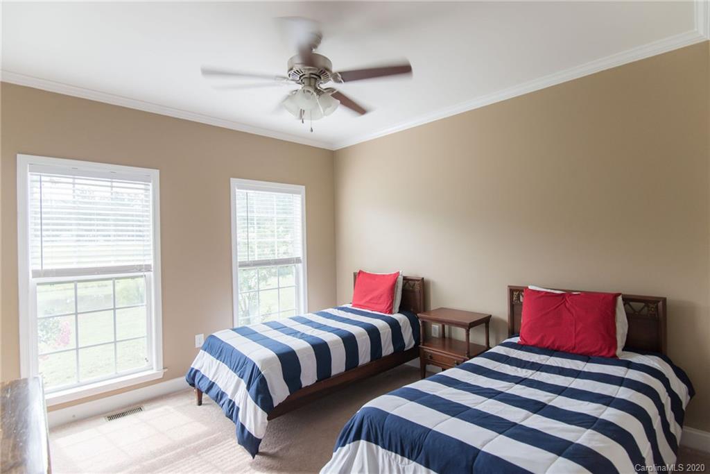 725 Hawley Road McConnells, SC 29726 - Photo 20 of 32 a bedroom with two beds and a window