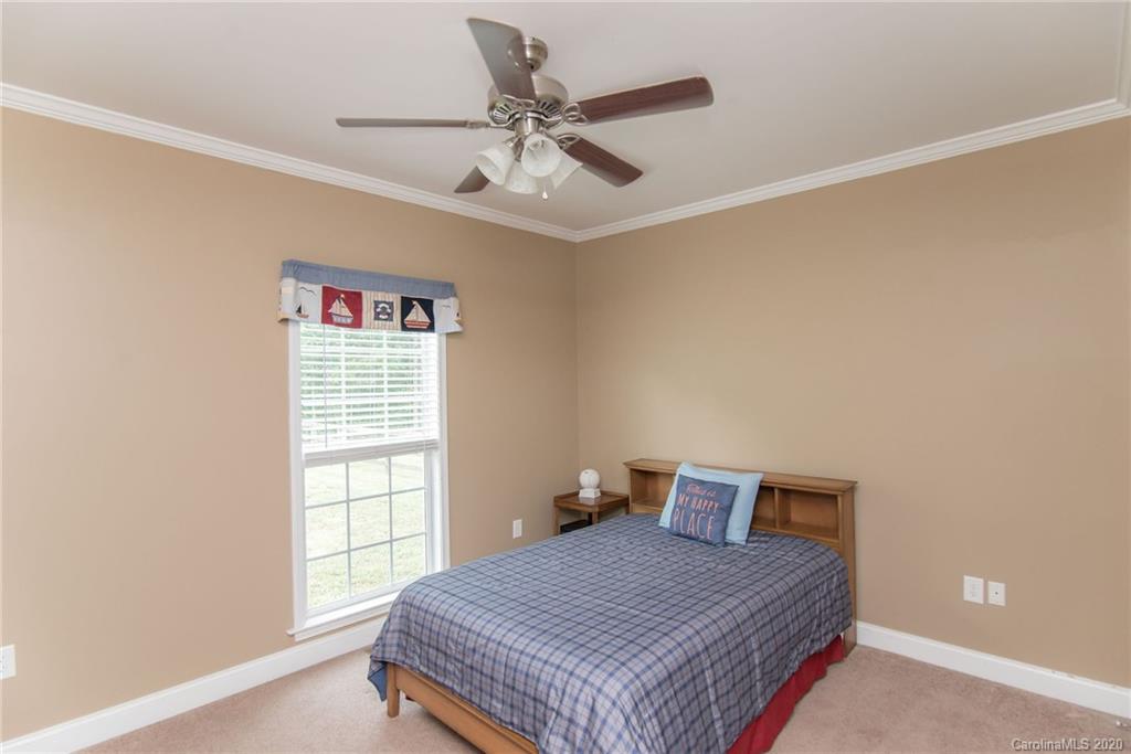 725 Hawley Road McConnells, SC 29726 - Photo 21 of 32 a bedroom with a bed and window