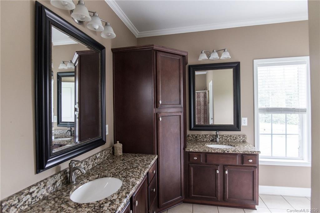 725 Hawley Road McConnells, SC 29726 - Photo 23 of 32 a bathroom with a granite countertop sink vanity mirror bathtub and shower