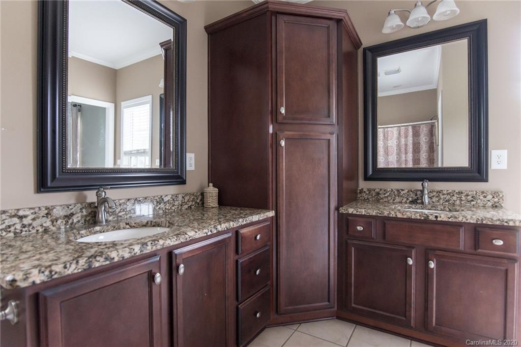 725 Hawley Road McConnells, SC 29726 - Photo 24 of 32 a bathroom with a granite countertop sink and a mirror