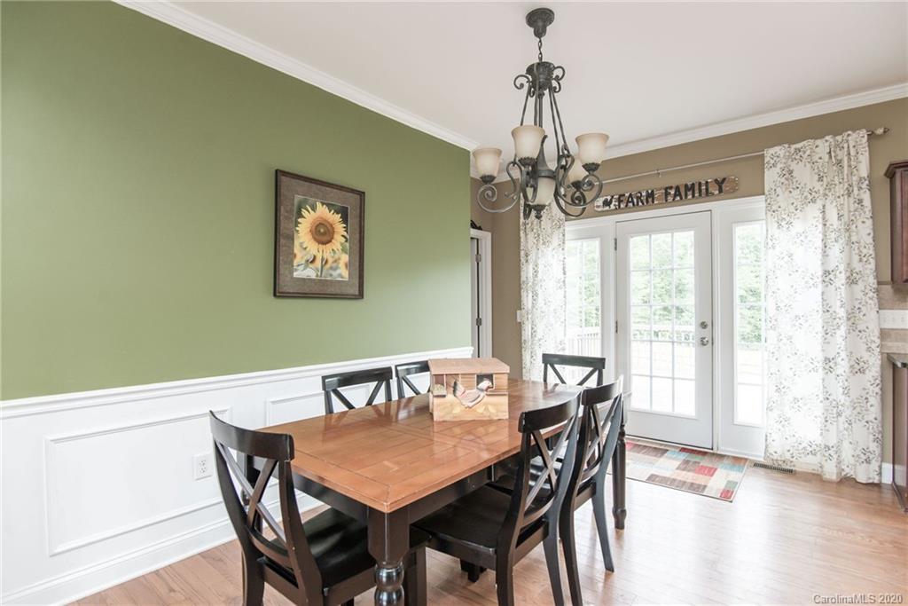 725 Hawley Road McConnells, SC 29726 - Photo 25 of 32 a view of a dining room with furniture window and wooden floor