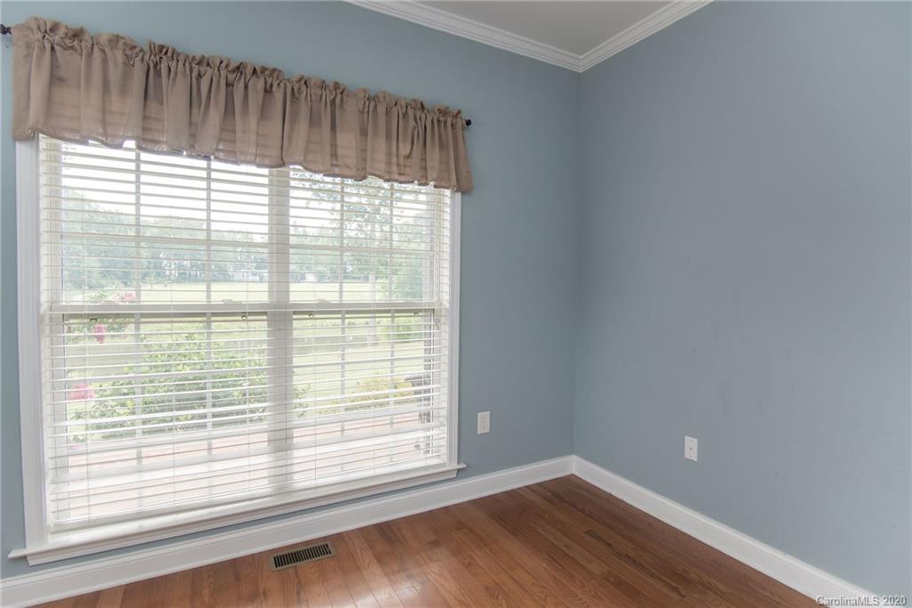 725 Hawley Road McConnells, SC 29726 - Photo 26 of 32 a view of an empty room with wooden floor and a window