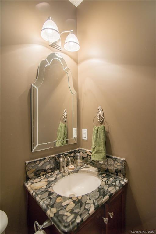 725 Hawley Road McConnells, SC 29726 - Photo 27 of 32 a bathroom with a granite countertop sink and a mirror