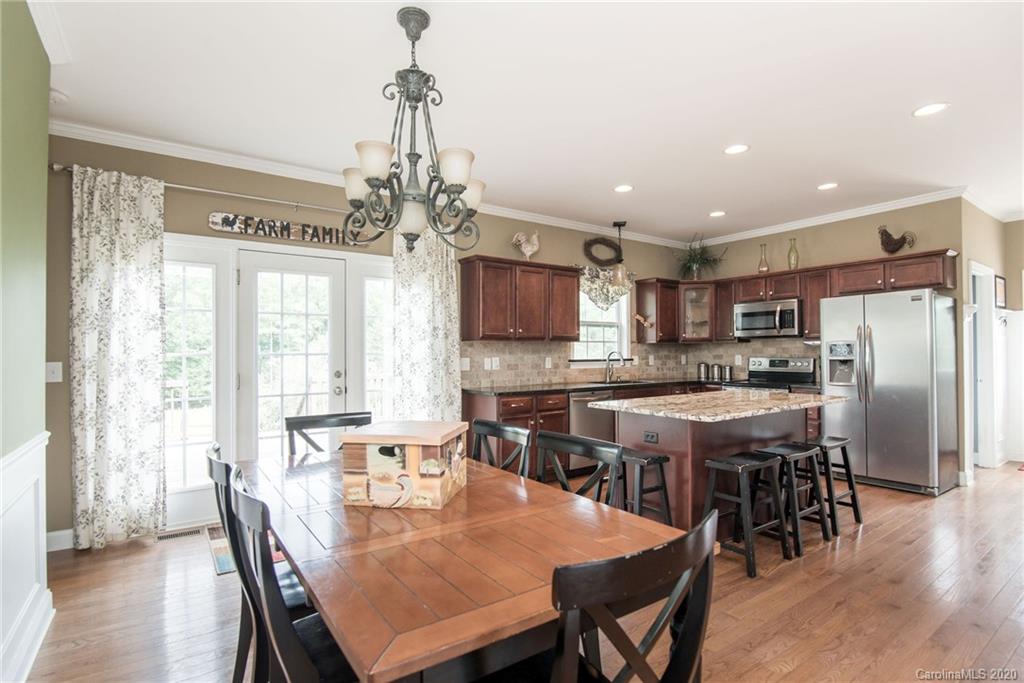 725 Hawley Road McConnells, SC 29726 - Photo 10 of 32 a large kitchen with a table and chairs
