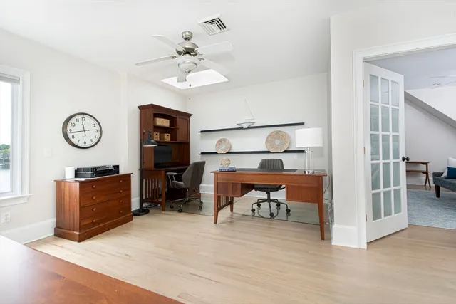 a view of a livingroom with furniture and a wooden floor