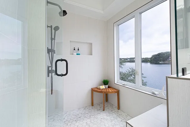 a living room with furniture a window and a shower