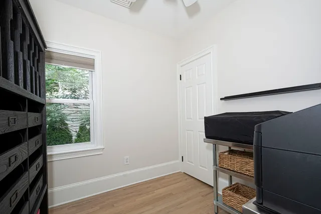 a room with a window and wooden floor
