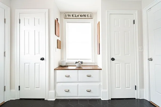 a bathroom with a sink a mirror and a window