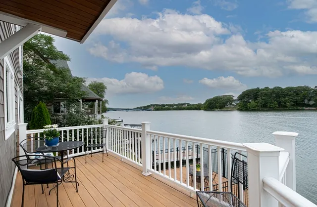a view of a deck with two chair and a table